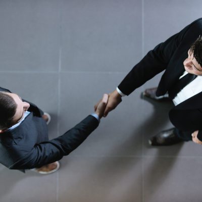 Business,People,Shaking,Hands,Make,Deal,And,Sign,Contract