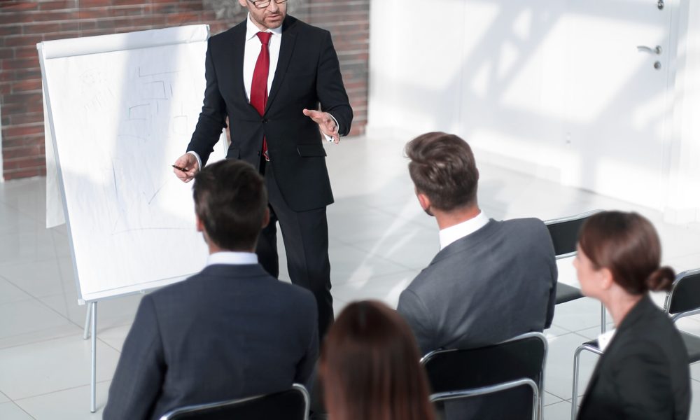 Businessman,And,Business,Team,Discussing,The,Presentation,Of,The,New